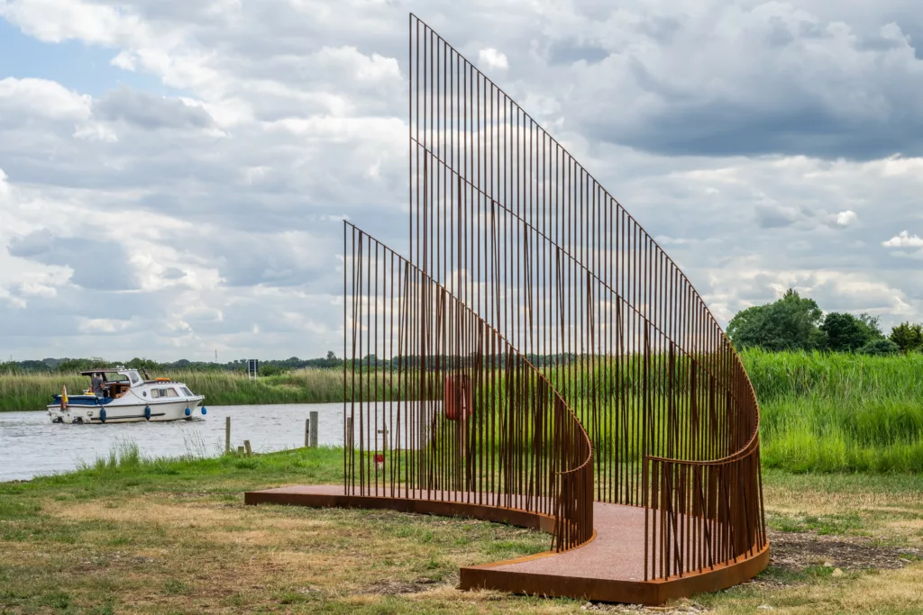 Norfolk Way Art Trail artwork 'Iron Reef' with the river Yare in the background