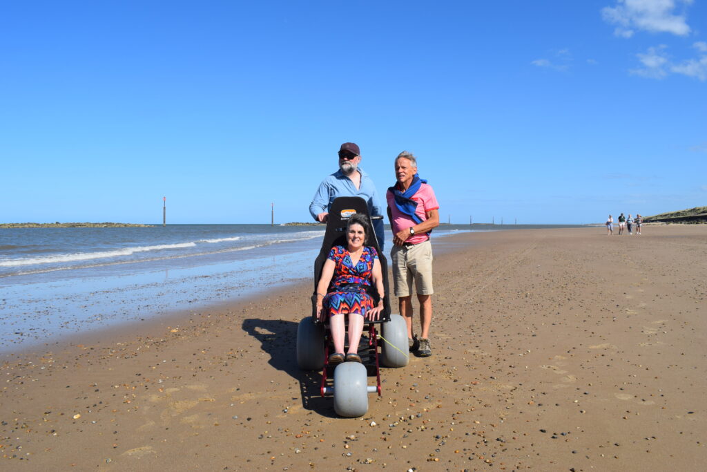 Lady using beach wheelchair